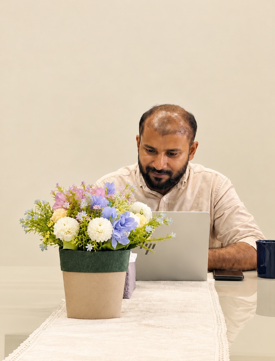 Aju Mathew at his desk